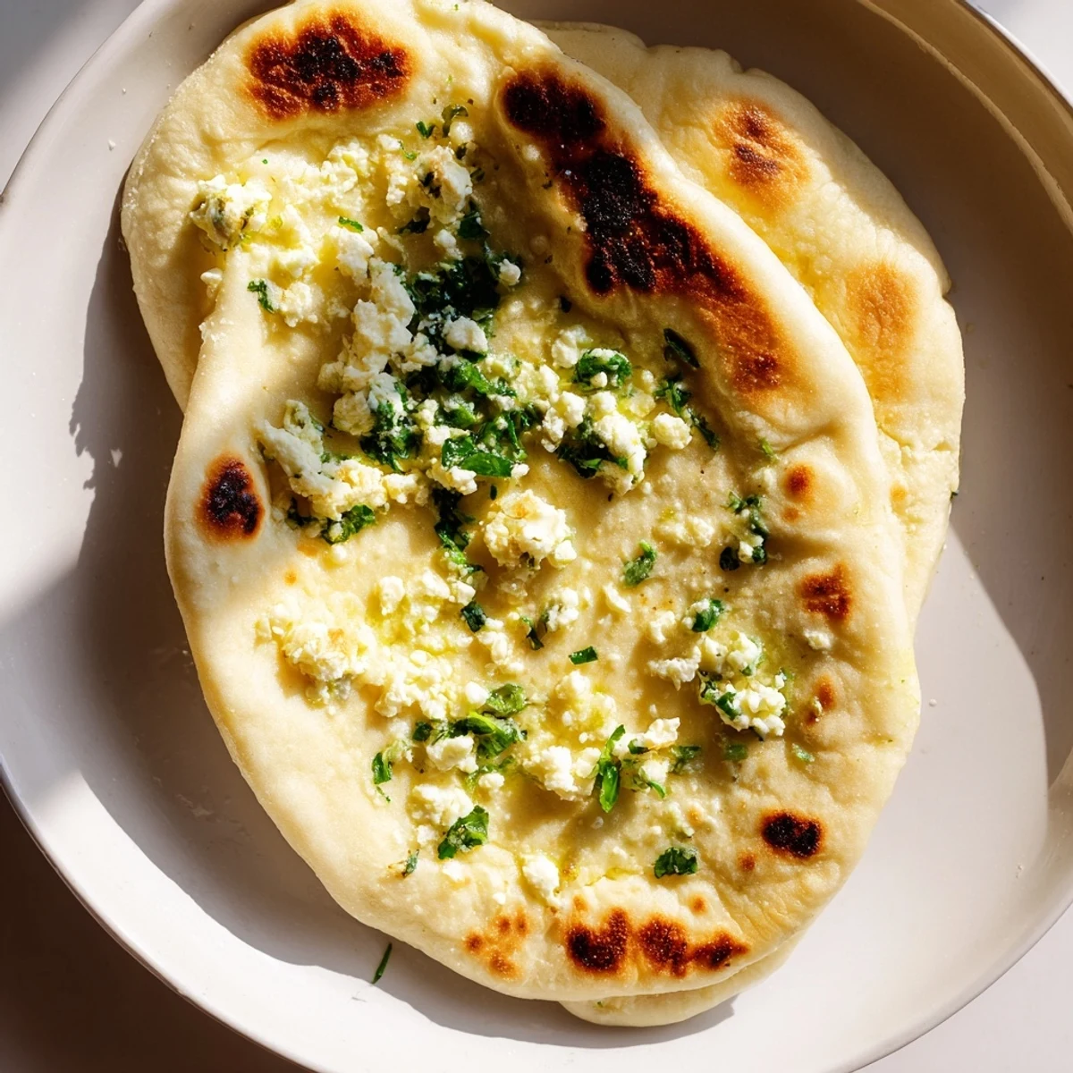 Serve this garlic-infused Cottage Cheese Garlic Naan alongside a bowl of spicy Indian curry.