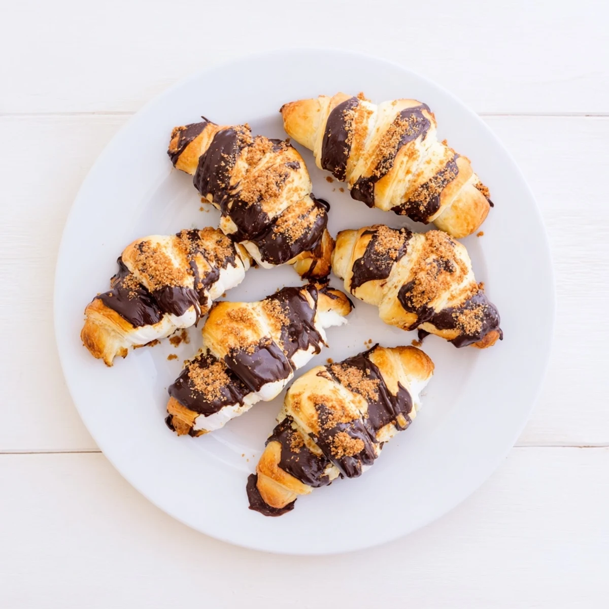 Warm Smores Crescent Rolls release steam and gooey chocolate, perfect served alongside a cold glass of milk for dipping.