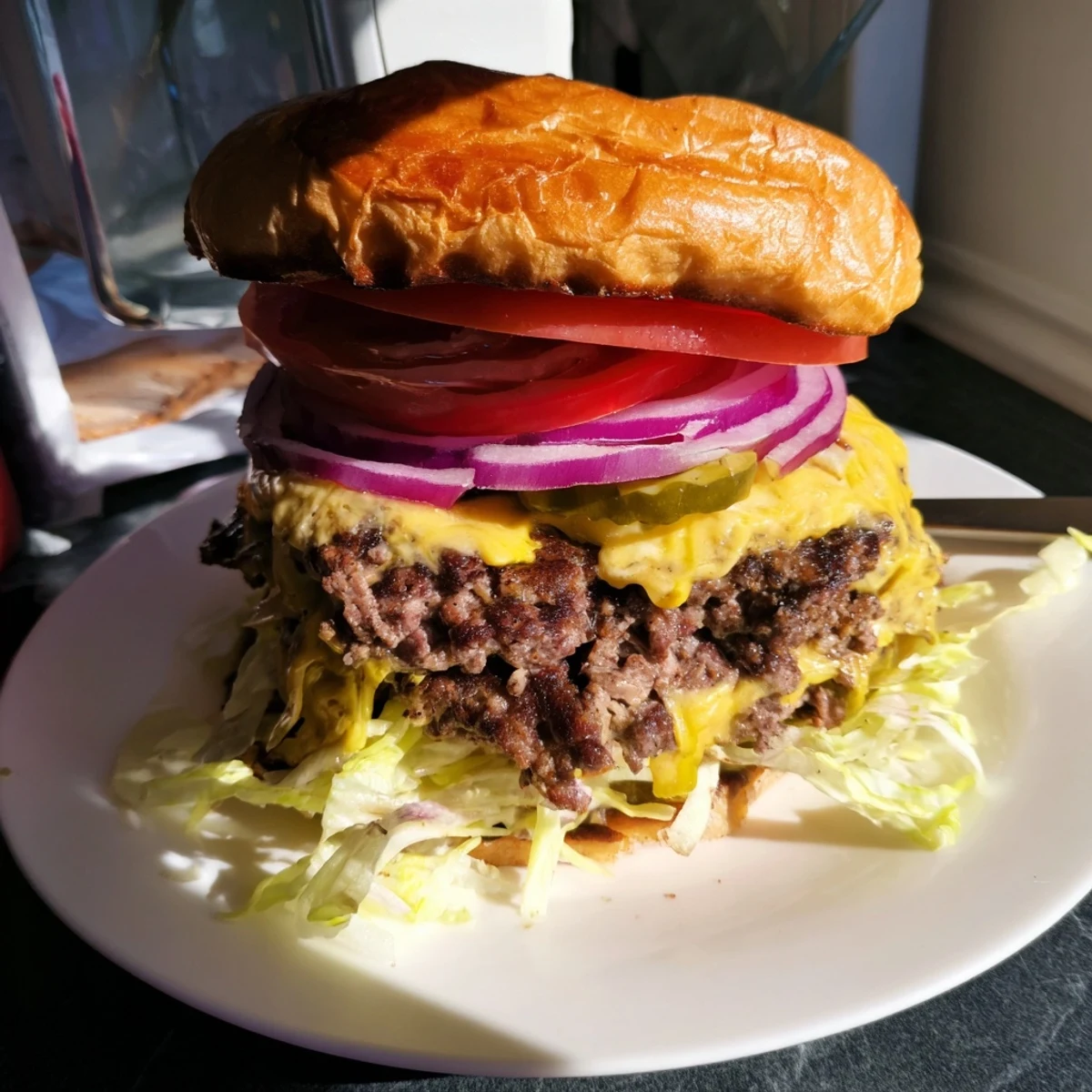 Golden juicy smash burger with melty American cheese on toasted brioche bun with crisp lettuce