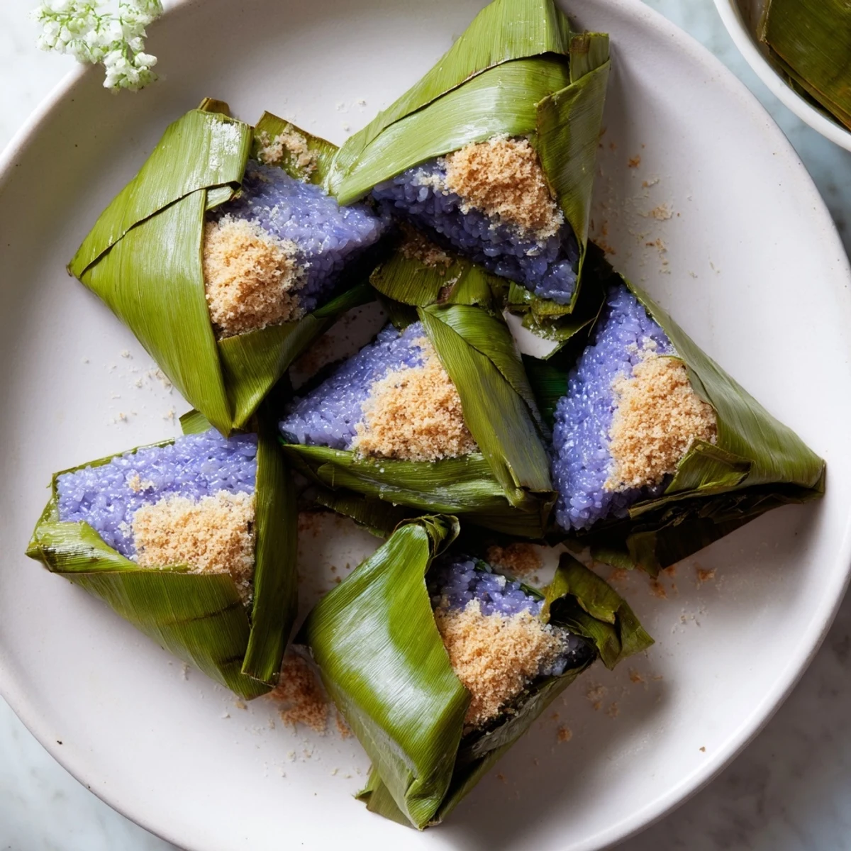 Homemade Malaysian Pulut Inti dessert showcasing sticky rice layered with caramelized coconut and gula Melaka