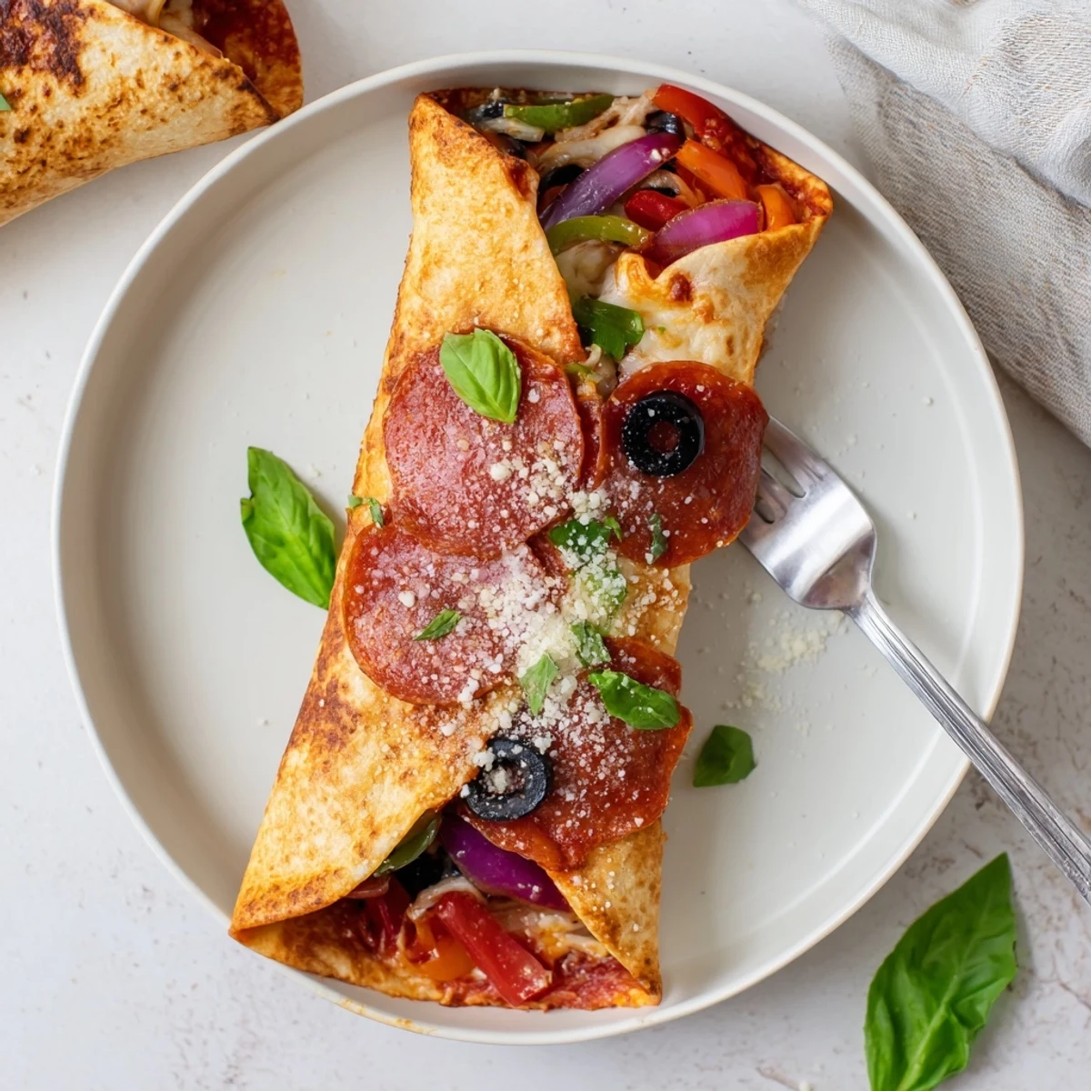 Golden oven baked pizza burritos with melted mozzarella and colorful vegetable fillings