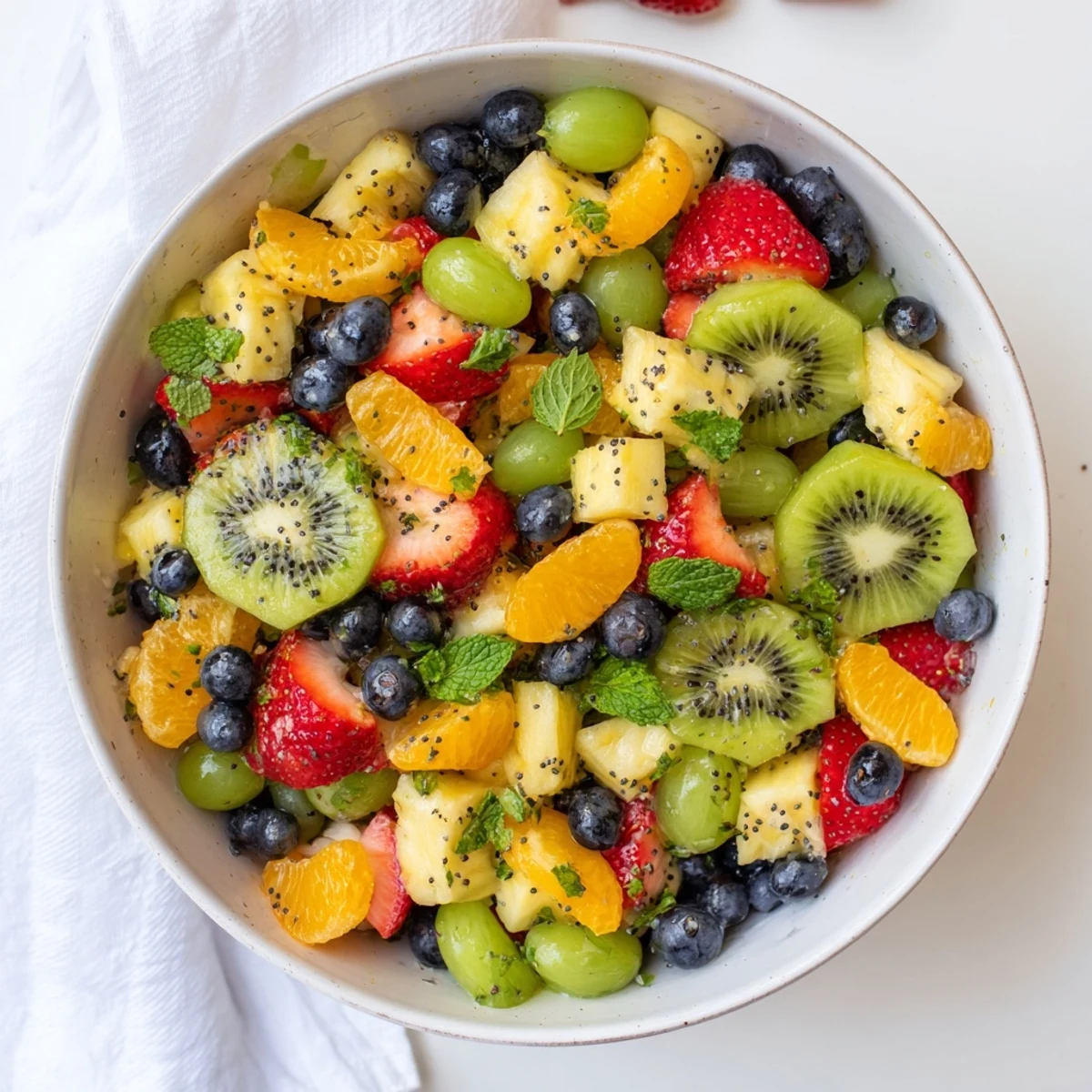 Refreshing Easter fruit salad displaying vibrant spring fruits in honey lime dressing
