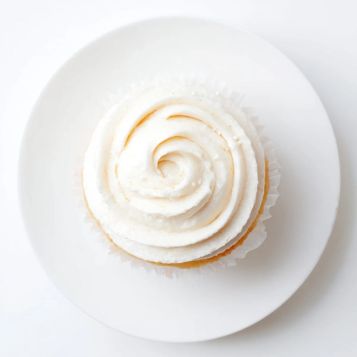 Perfectly baked vanilla cupcakes with smooth buttercream frosting and colorful sprinkles for a festive celebration dessert
