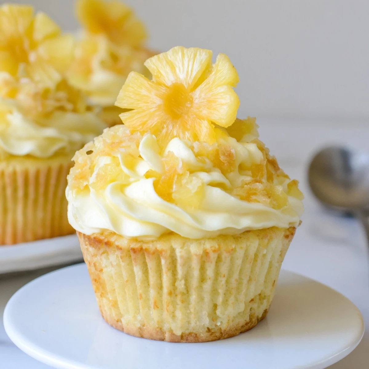 Plate of Dole Whip Cupcakes Recipe ready to serve, sweet tropical scent.