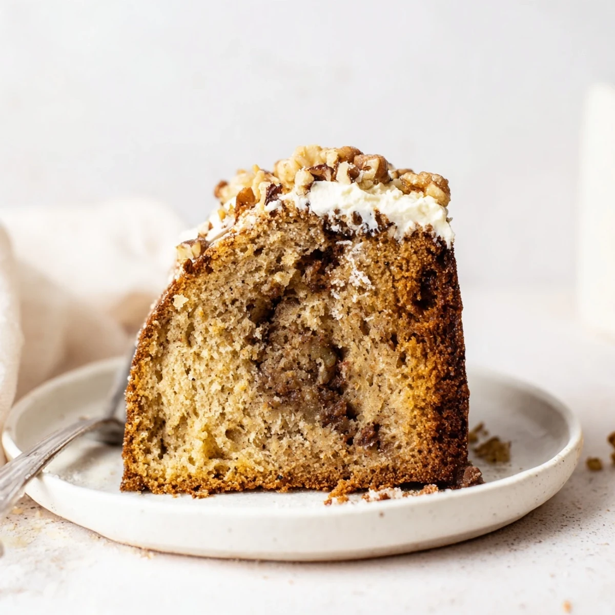 Banana Bread Cake Recipe: moist golden slice on a plate, steam rising