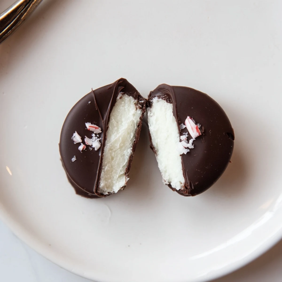 Stacked Peppermint Patties beside a mug, cool mint aroma and shiny sheen