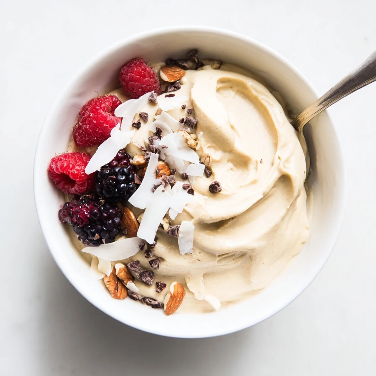 Vegan healthy nice cream recipe with smooth soft serve texture and dark chocolate chips