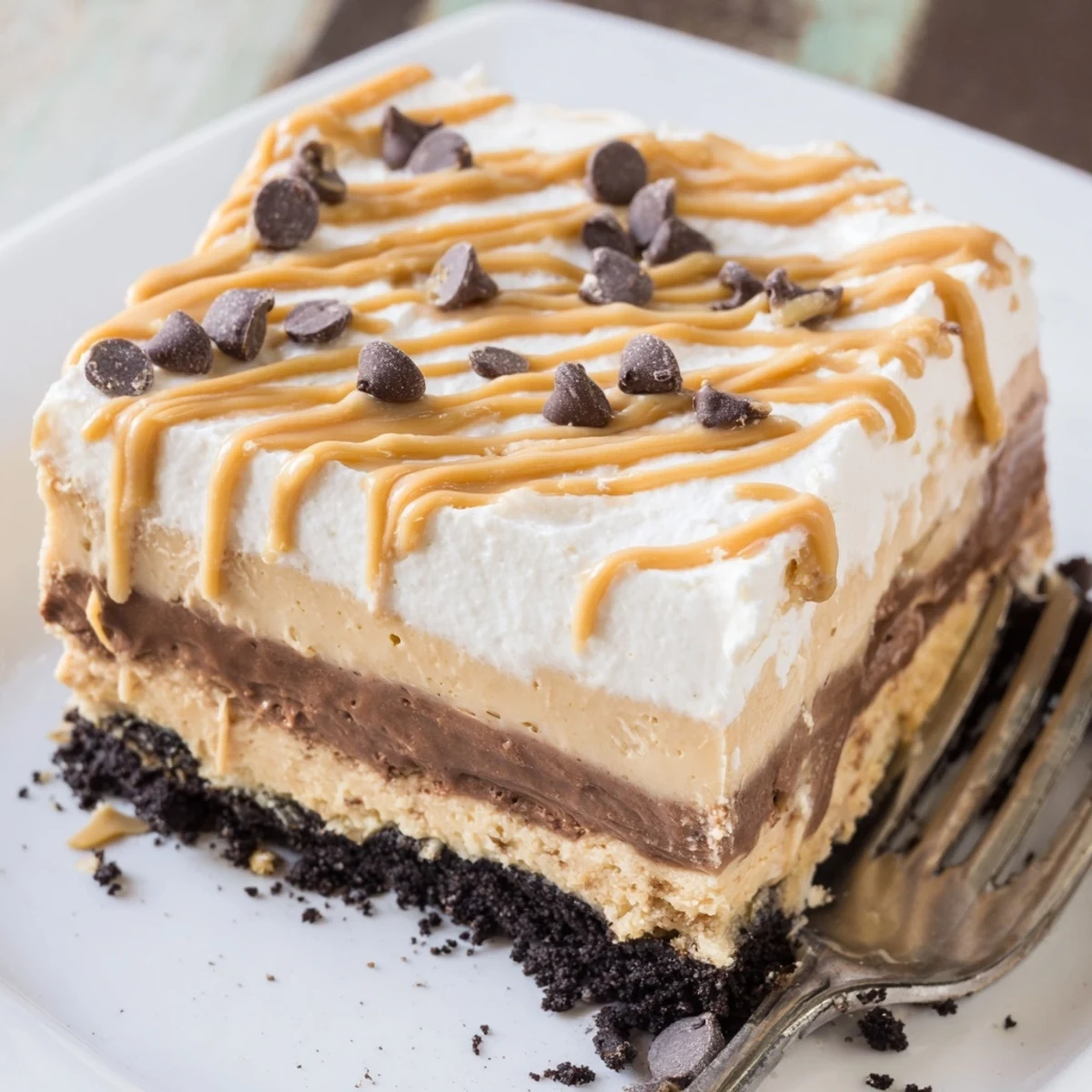 Peanut butter layered delight sliced into neat squares showing distinct creamy layers